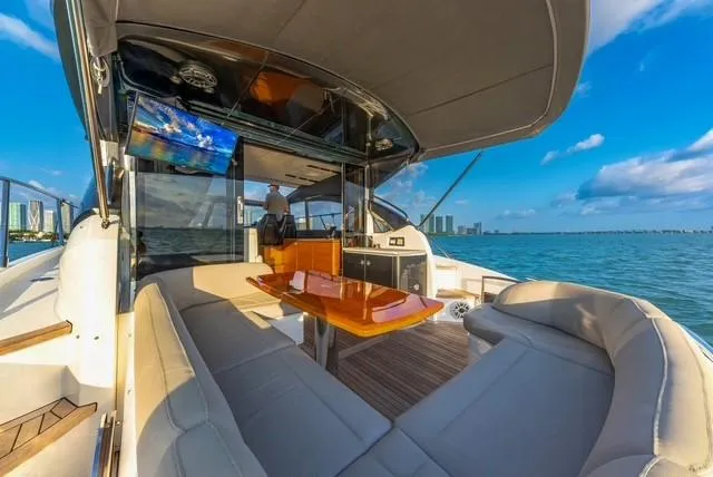 Slide: The Image of Luxurious 2017 Princess V48 Open yacht interior with ocean view and modern seating. - 18