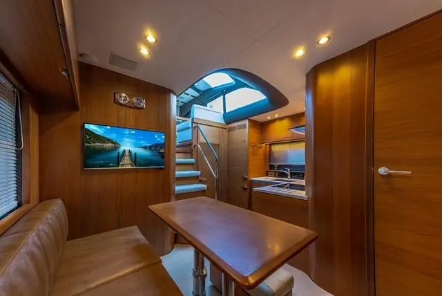 Slide: The Image of Interior of 2017 Princess V48 Open yacht with modern design and wooden finishes. - 21