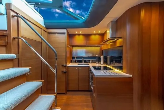 Slide: The Image of Luxurious interior of 2017 Princess V48 Open yacht with modern kitchen and skylight. - 22
