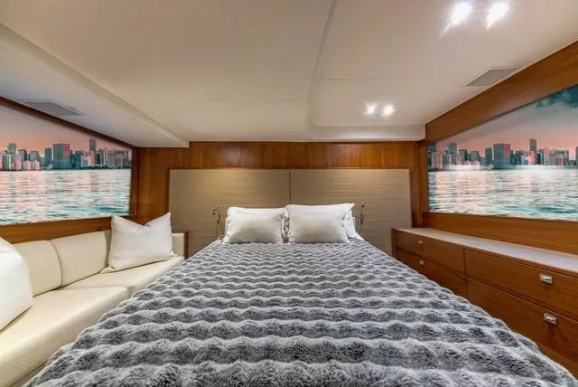 Slide: The Image of Luxurious bedroom interior of 2017 Princess V48 Open yacht with cityscape views. - 28