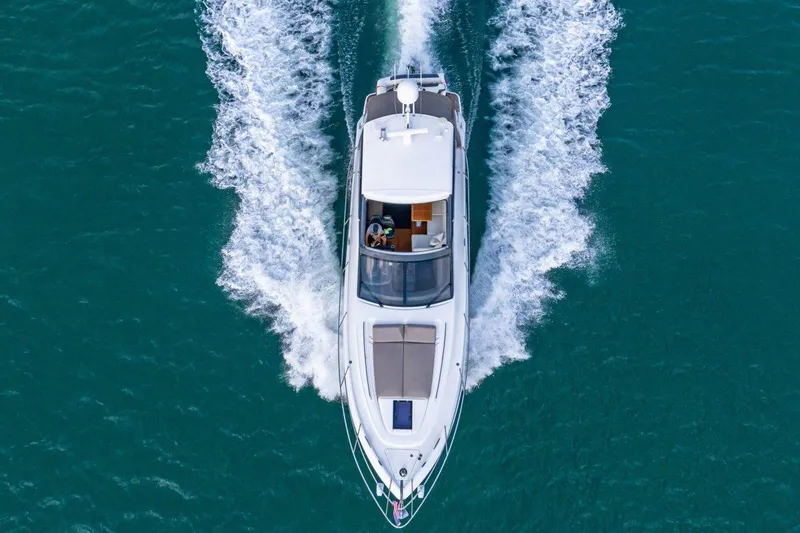 Slide: The Image of Aerial view of 2017 Princess V48 Open yacht cruising on blue water. - 31