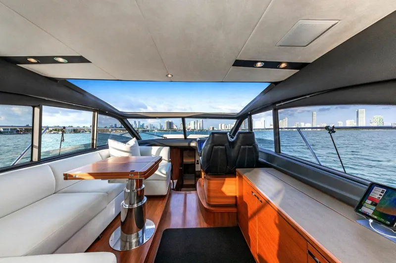 Slide: The Image of Luxurious interior of 2017 Princess V48 Open yacht with panoramic windows and elegant seating. - 8