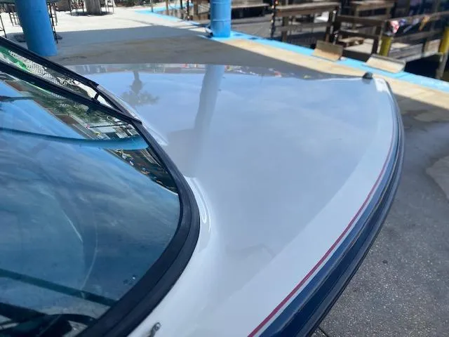 Slide: The Image of 1998 Malibu Response boat bow with sleek design and glossy finish. - 15