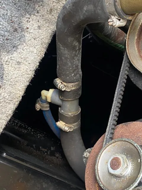 Slide: The Image of Close-up of 1998 Malibu Response engine hoses and belt system. - 23