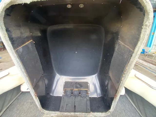 Slide: The Image of Interior view of a 1998 Malibu Response boat compartment. - 25