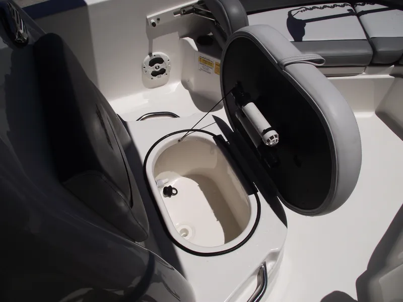 Slide: The Image of 2022 NauticStar 191 Hybrid boat interior with open storage compartment. - 18