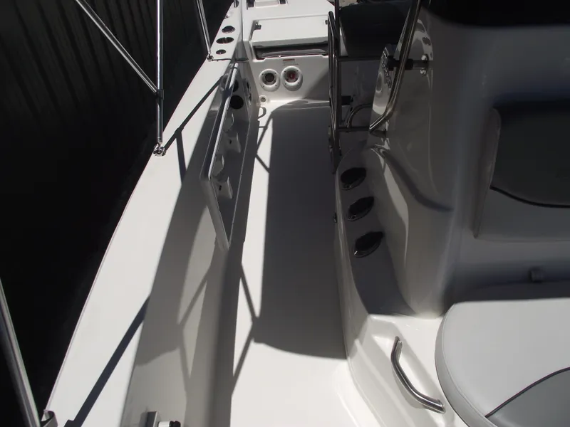 Slide: The Image of 2022 NauticStar 191 Hybrid boat interior with seating and storage compartments. - 19