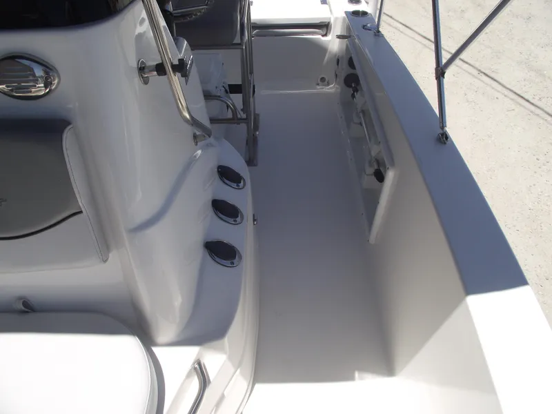 Slide: The Image of 2022 NauticStar 191 Hybrid boat interior, featuring sleek white deck and seating area. - 21