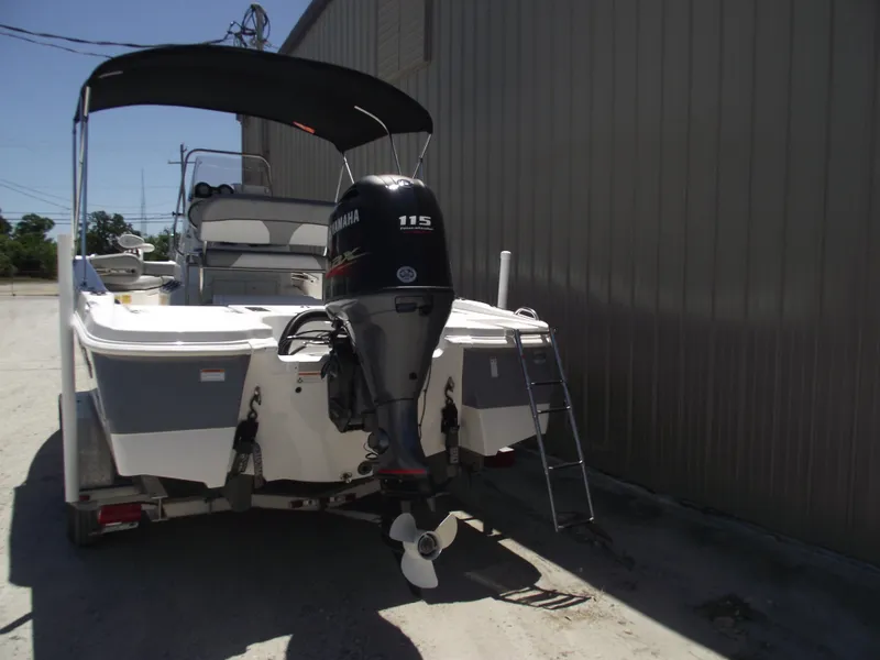 Slide: The Image of 2022 NauticStar 191 Hybrid boat with Yamaha 115 outboard motor and ladder. - 3