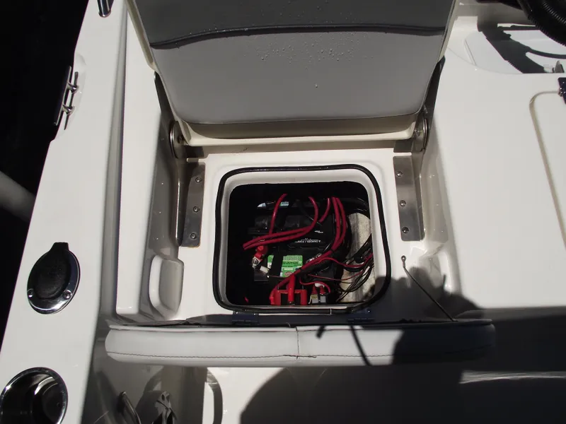 Slide: The Image of 2022 NauticStar 191 Hybrid boat battery compartment with visible wiring. - 35