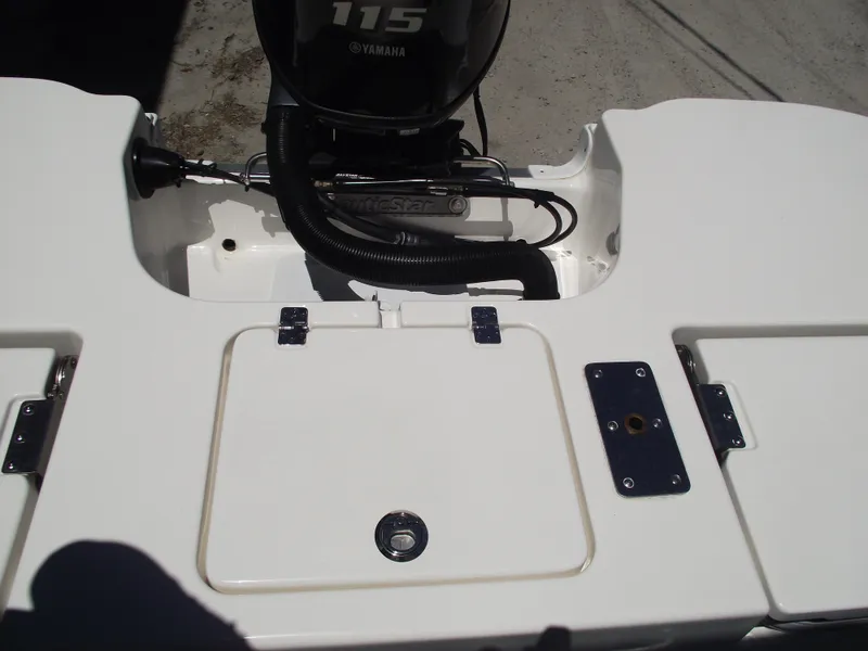 Slide: The Image of 2022 NauticStar 191 Hybrid boat with Yamaha 115 engine, rear deck view. - 36