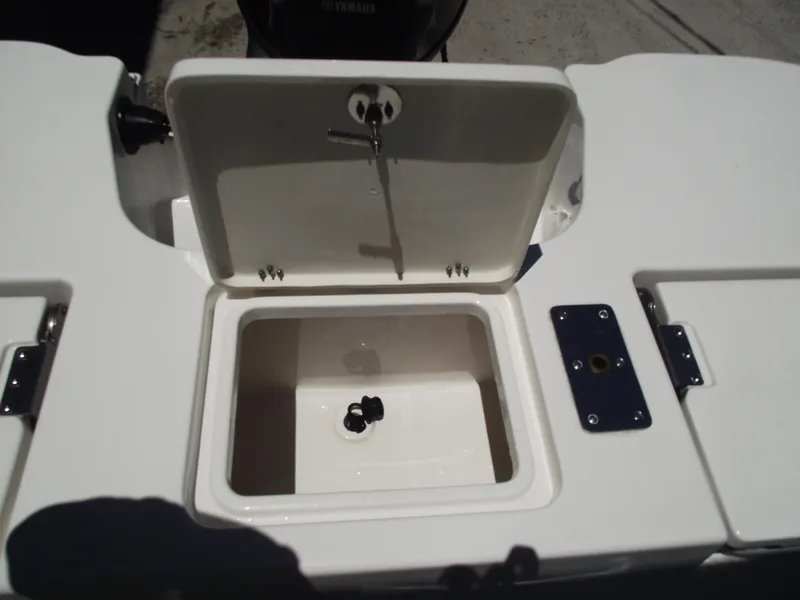 Slide: The Image of 2022 NauticStar 191 Hybrid boat storage compartment with open lid. - 37