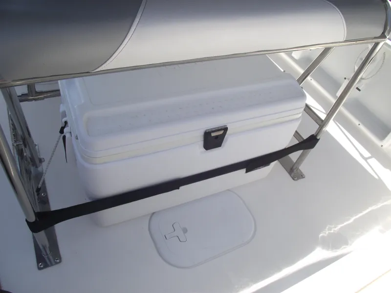 Slide: The Image of 2022 NauticStar 191 Hybrid boat interior with cooler and seating. - 38