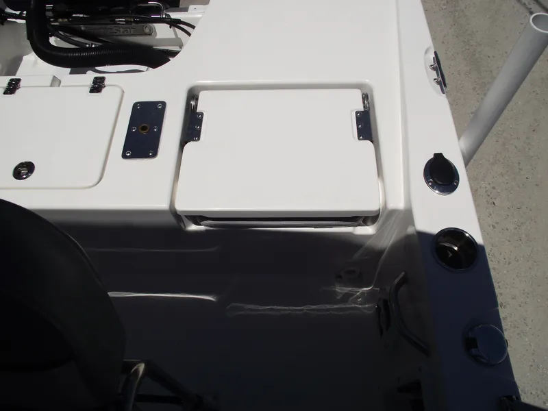 Slide: The Image of 2022 NauticStar 191 Hybrid boat deck with storage compartments and rod holders. - 39