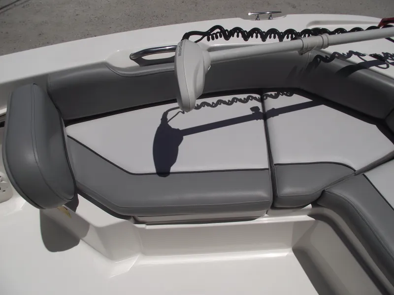 Slide: The Image of 2022 NauticStar 191 Hybrid boat interior with gray seating and trolling motor. - 8