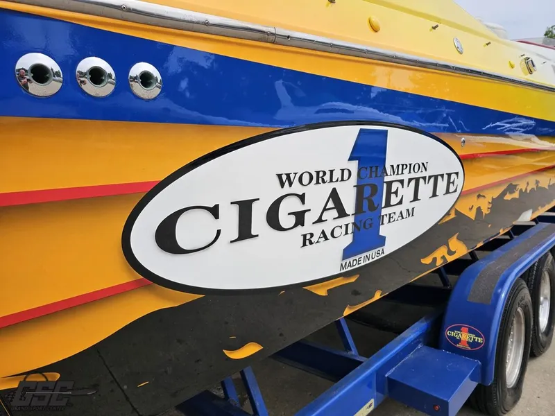 Slide: The Image of 2001 Cigarette 42 Tiger boat with vibrant racing team graphics. - 10