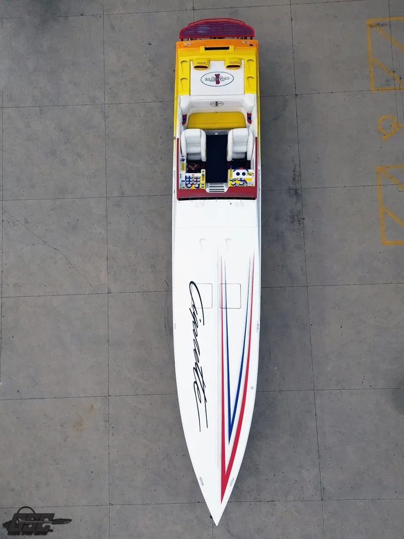 Slide: The Image of 2001 Cigarette 42 Tiger speedboat, aerial view, sleek design with vibrant red, blue, and yellow accents. - 19