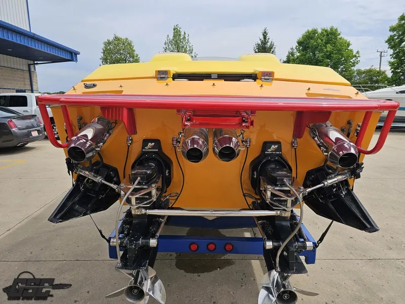 Slide: The Image of Rear view of a 2001 Cigarette 42 Tiger boat with vibrant yellow and red accents. - 32