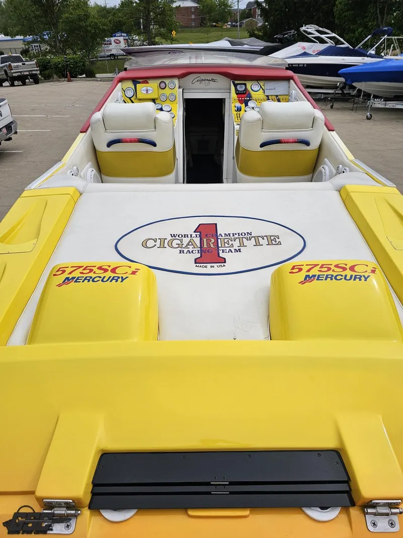 Slide: The Image of 2001 Cigarette 42 Tiger boat with yellow and white seating, featuring Mercury engines. - 37