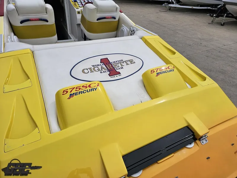 Slide: The Image of 2001 Cigarette 42 Tiger boat with yellow accents and Mercury 575SCi engines. - 38