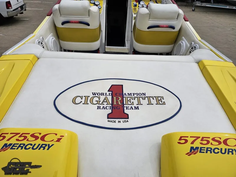 Slide: The Image of 2001 Cigarette 42 Tiger boat interior with racing team logo and Mercury branding. - 39
