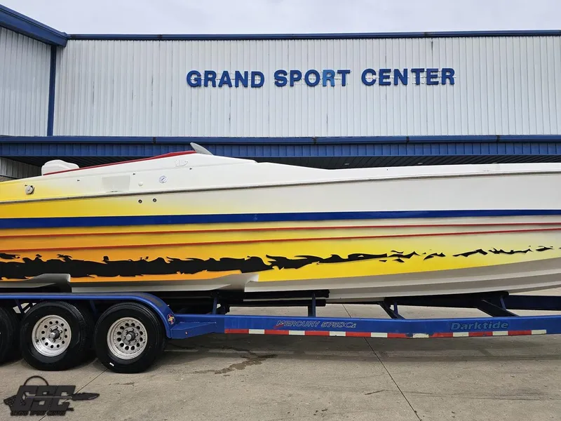 Slide: The Image of 2001 Cigarette 42 Tiger boat with vibrant graphics at Grand Sport Center. - 4
