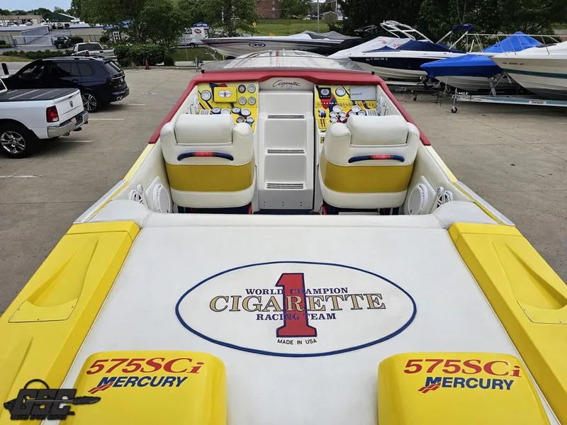 Slide: The Image of 2001 Cigarette 42 Tiger boat with Mercury engines, parked in a marina. - 41