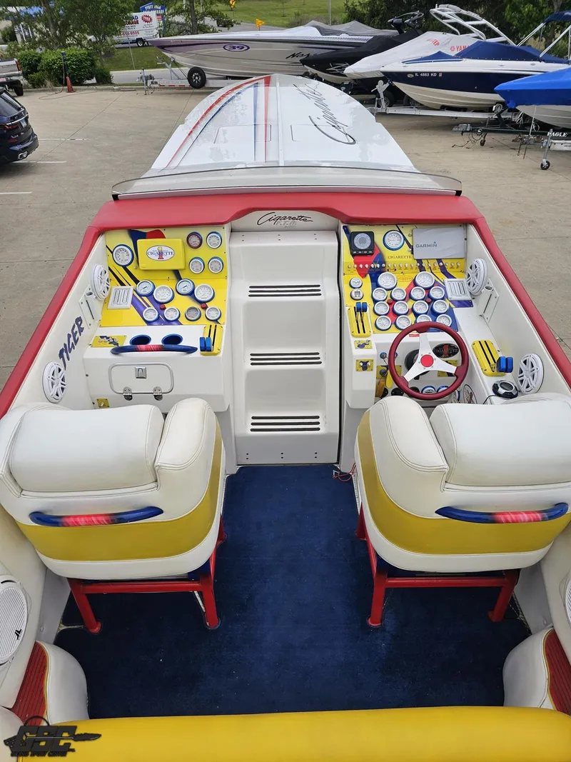 Slide: The Image of 2001 Cigarette 42 Tiger boat interior with colorful dashboard and seating. - 43