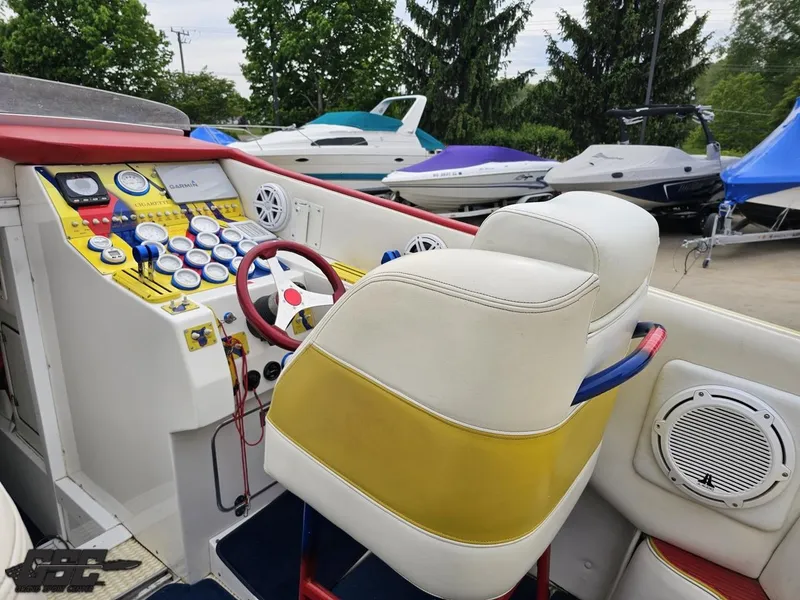 Slide: The Image of 2001 Cigarette 42 Tiger boat cockpit with colorful dashboard and dual seats. - 48