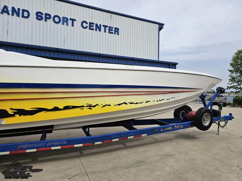 Slide: The Image of 2001 Cigarette 42 Tiger boat on trailer, parked outside a sport center. - 5