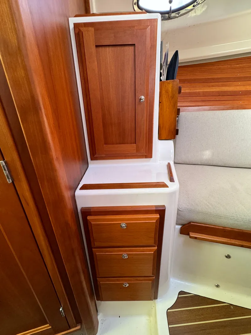 Slide: The Image of Port side cedar closet with cherry drawer storage - 14