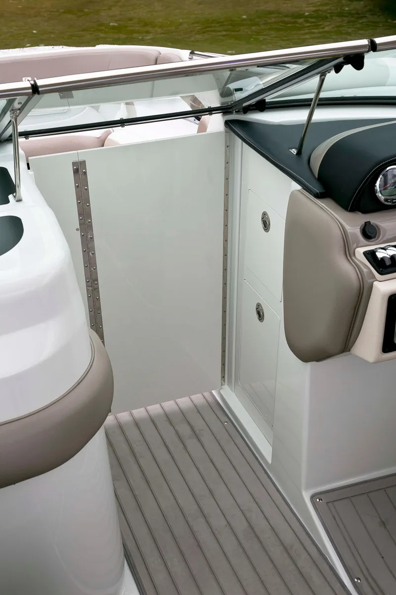 Slide: The Image of 2024 Crownline E305 boat interior with sleek design and modern dashboard features. - 15