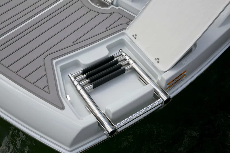Slide: The Image of 2024 Crownline E305 boat swim platform with retractable ladder and non-slip surface. - 17