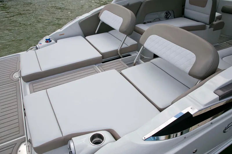 Slide: The Image of 2024 Crownline E305 boat interior with cushioned seating and sleek design. - 19