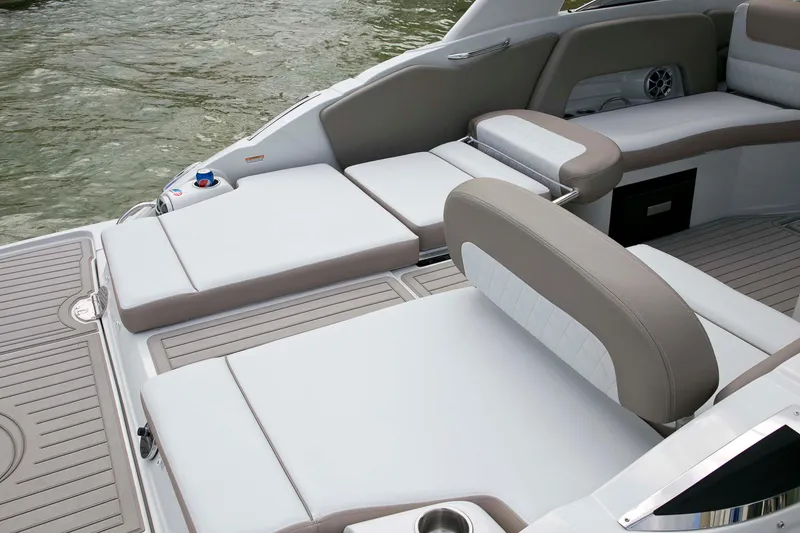 Slide: The Image of 2024 Crownline E305 boat interior with luxurious seating and modern design on the water. - 20