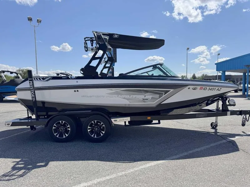 Slide: The Image of 2017 Nautique GS20 boat on trailer under clear sky. - 9