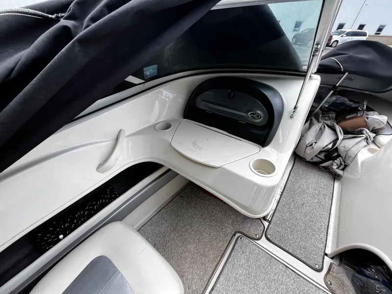 Slide: The Image of 2008 Sea Ray 205 Sport boat interior with seating and storage compartments. - 11