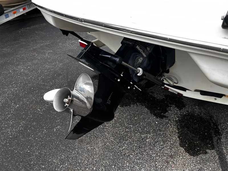 Slide: The Image of 2008 Sea Ray 205 Sport boat propeller and stern drive on pavement. - 15