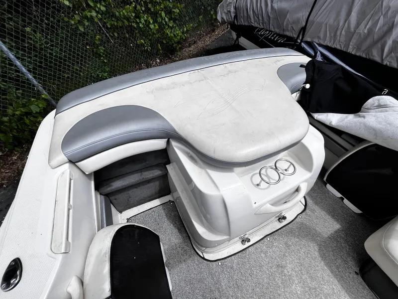 Slide: The Image of 2008 Sea Ray 205 Sport boat interior with cushioned seating and cup holders. - 5