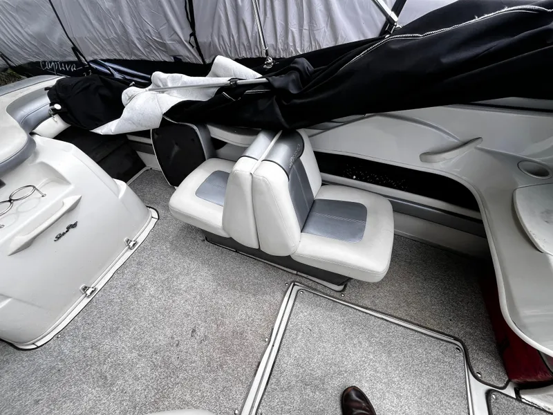 Slide: The Image of Interior of a 2008 Sea Ray 205 Sport boat with seating and storage. - 9