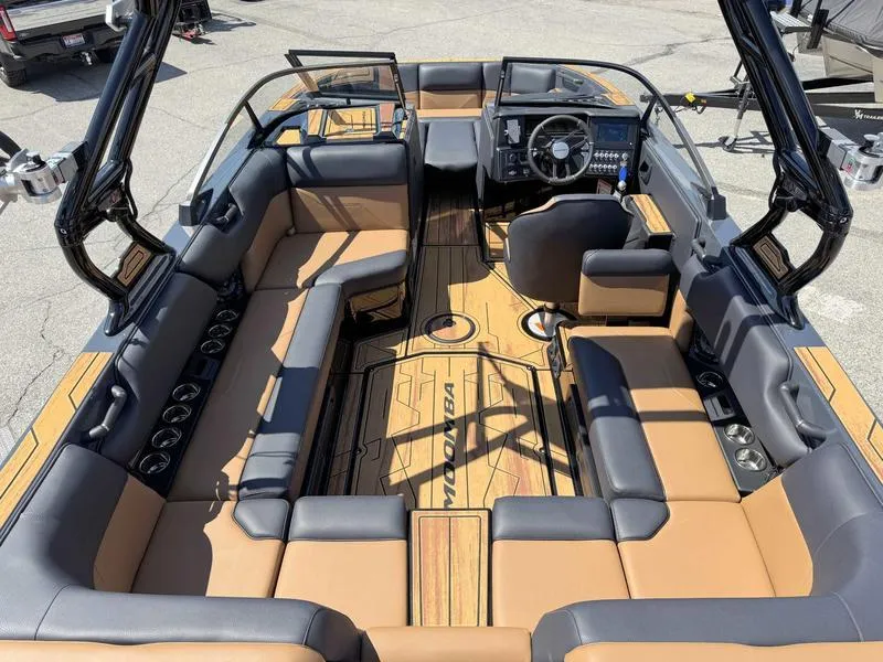 Slide: The Image of 2025 Moomba Max boat interior with spacious seating and modern dashboard design. - 5