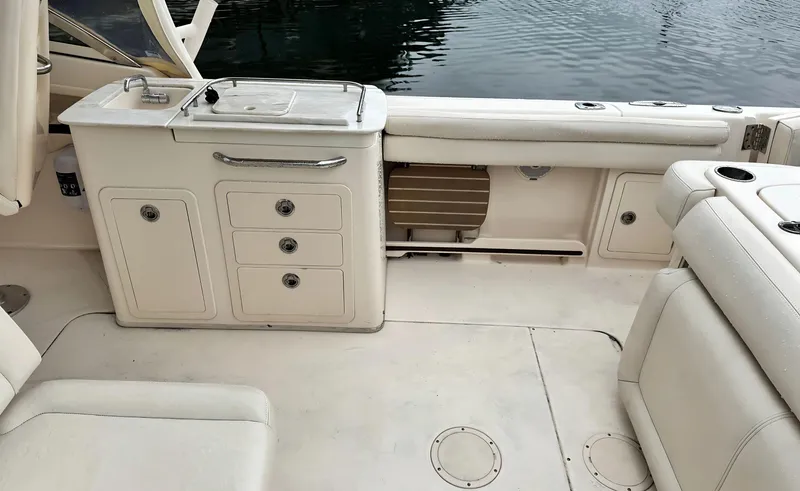 Slide: The Image of 2017 Grady-White Freedom 275 boat interior with seating and storage compartments. - 4