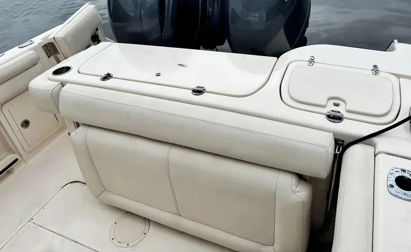 Slide: The Image of 2017 Grady-White Freedom 275 boat interior with seating and storage compartments. - 5