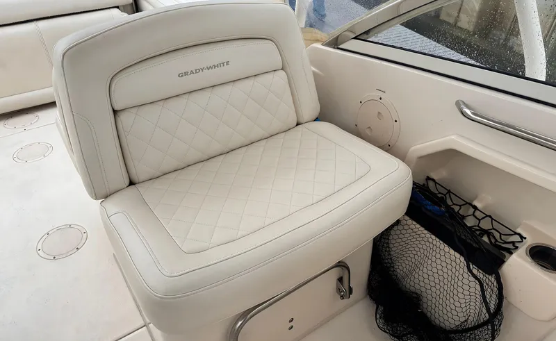 Slide: The Image of 2017 Grady-White Freedom 275 boat seat with quilted upholstery and storage net. - 6