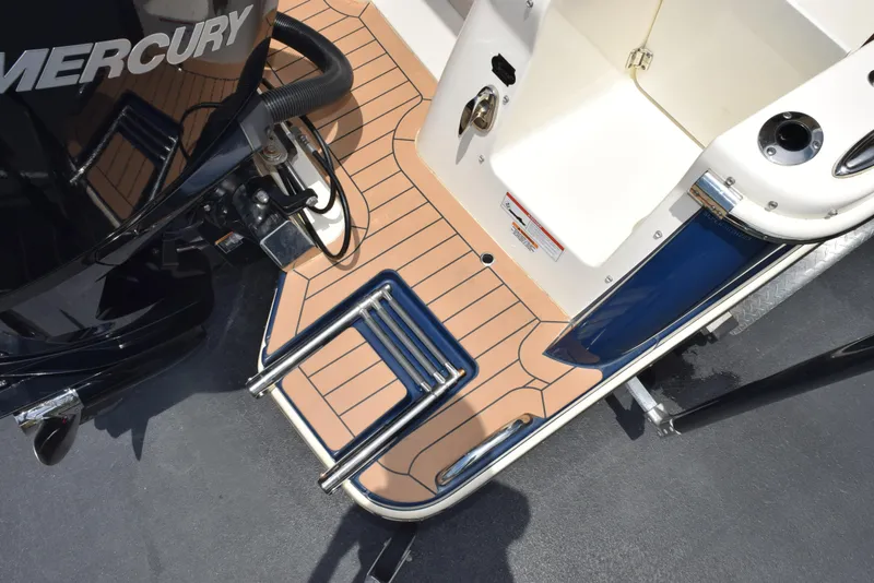 Slide: The Image of 2023 Scout 277 Dorado boat with Mercury engine and swim platform ladder. - 10