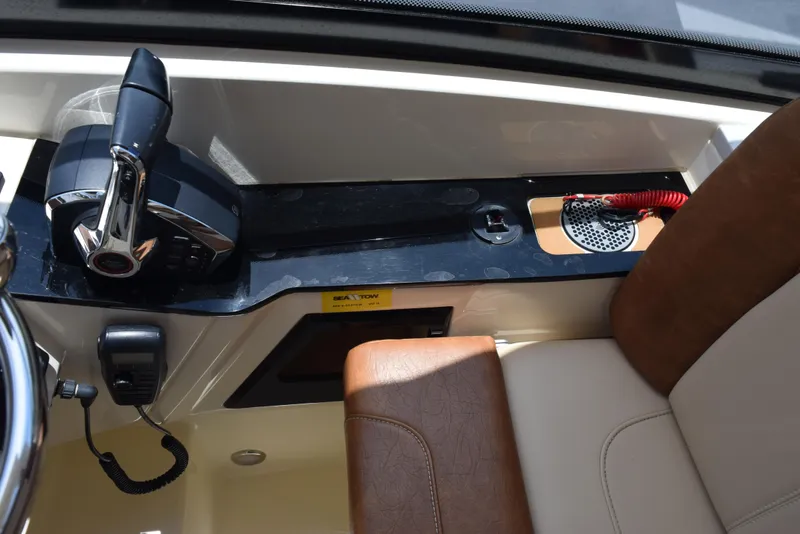 Slide: The Image of 2023 Scout 277 Dorado boat interior with control panel and seating. - 17