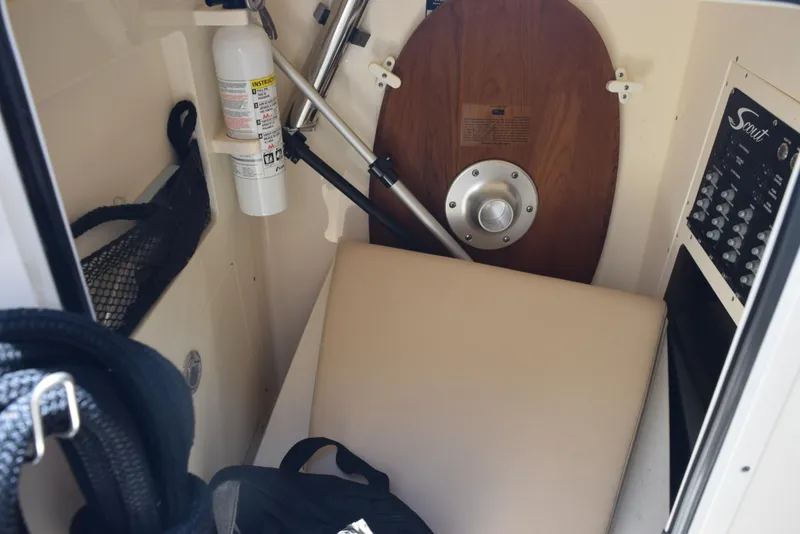 Slide: The Image of 2023 Scout 277 Dorado interior with safety equipment and storage area. - 31