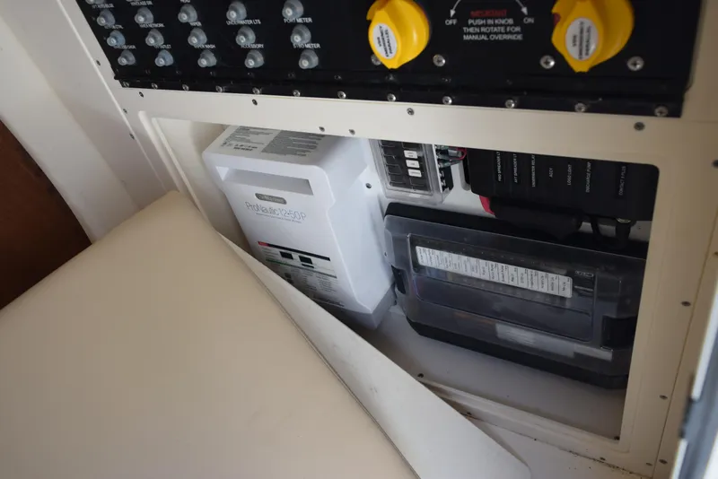 Slide: The Image of Electrical panel and components inside a 2023 Scout 277 Dorado boat. - 33