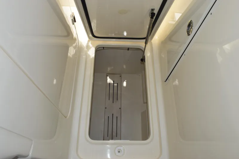 Slide: The Image of 2023 Scout 277 Dorado boat interior storage compartment, open hatch view. - 34