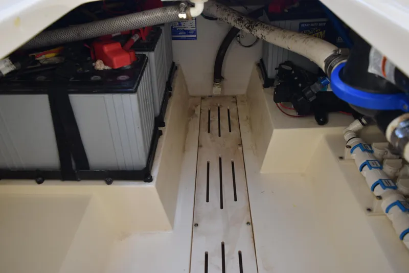 Slide: The Image of 2023 Scout 277 Dorado boat interior showing battery compartment and wiring. - 35